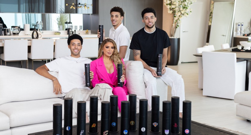 Real Housewives of Miami star, Larsa Pippen, with her children, Preston, Justin and NBA player Scotty Pippen, Jr. alongside several Aroma360 NBA team mini pro diffusers.